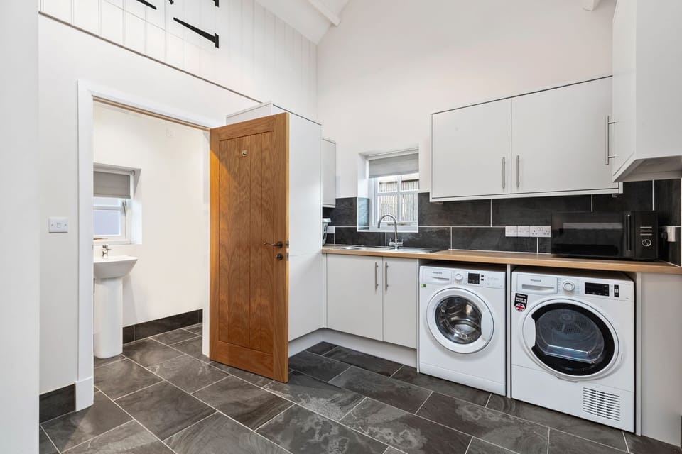 useful utility room for muddy boots and walking gear
