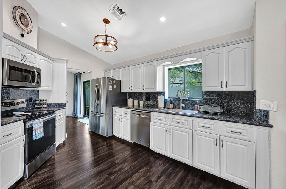 Fully equipped kitchen with all of the appliances, utensils, and amenities you need to prepare meals (1)