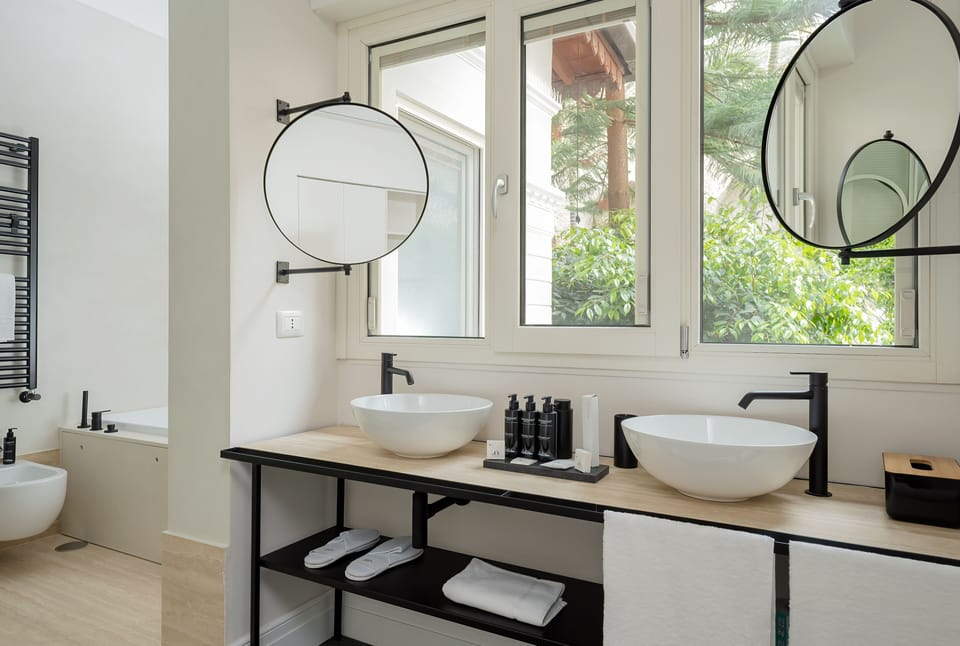 Exclusive Suite | Bathroom | Designer toiletries, hair dryer, slippers, bidet