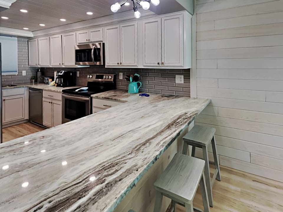 Condo, Multiple Beds, Balcony, Ocean View | Private kitchen | Fridge, microwave, oven, stovetop