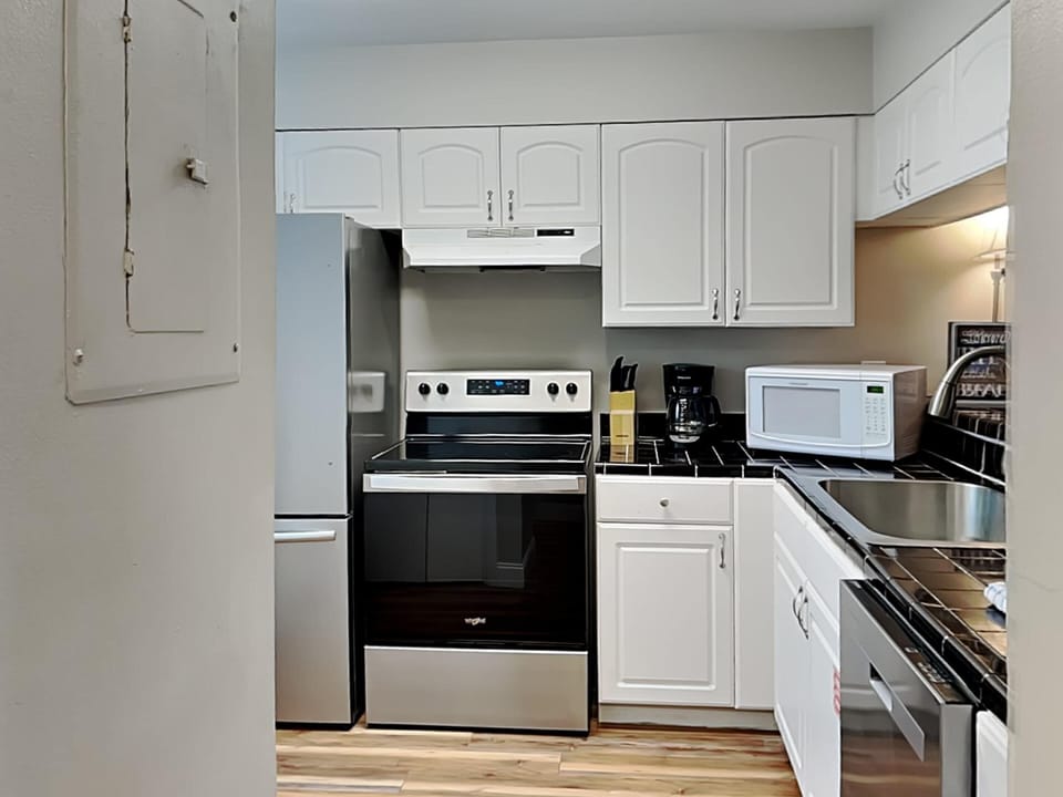 Condo, Multiple Beds, Patio, Pool View | Private kitchen | Fridge, microwave, oven, stovetop
