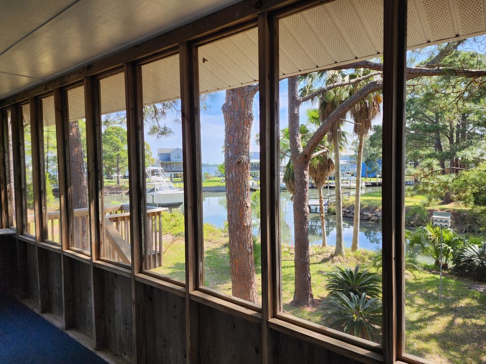 Screened in full-length back porch