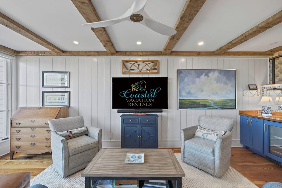 Living area featuring spacious seating and a tv.