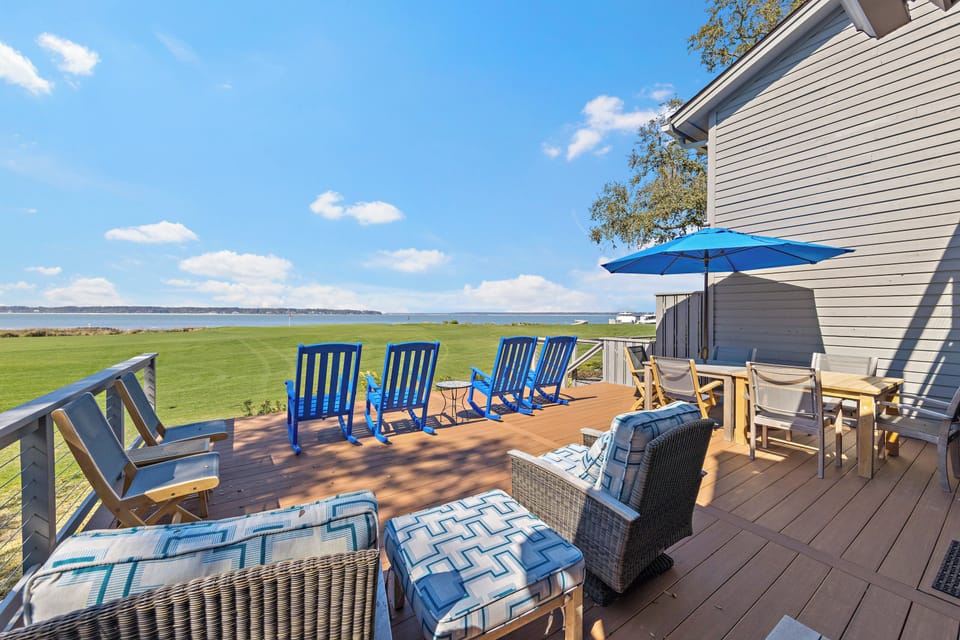 Private deck featuring plenty of space for all guests plus a table to enjoy meals on.