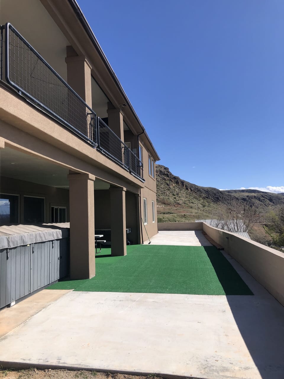 Back patio great space, wonderful views. Corn hole game under air hokey table.
