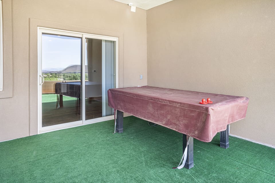Air hockey, we now have a corn hole game under this table.