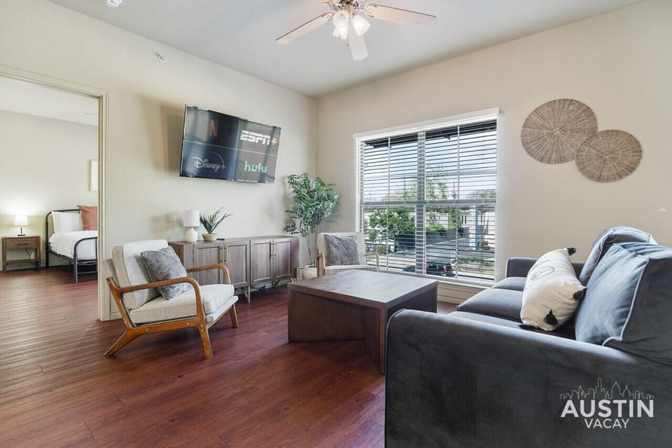Spacious and open living and dining room with smart tv