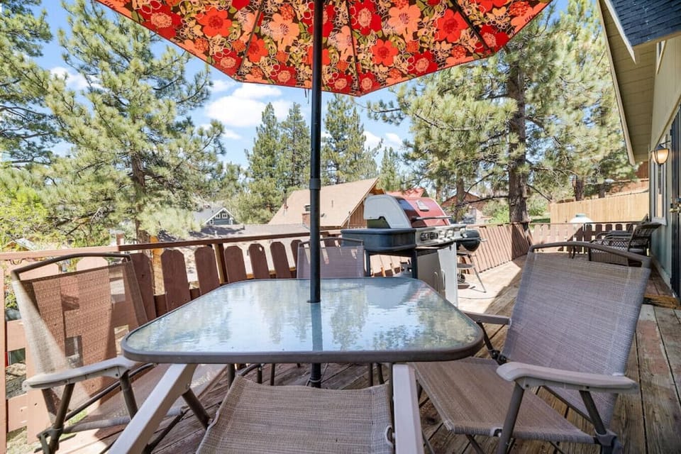 bring a cup of coffee and watch the day begin- the birds often come by our colorful umbrella!