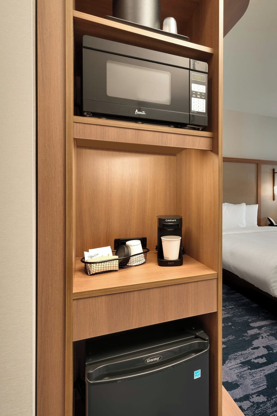 Hypo-allergenic bedding, desk, laptop workspace, blackout drapes