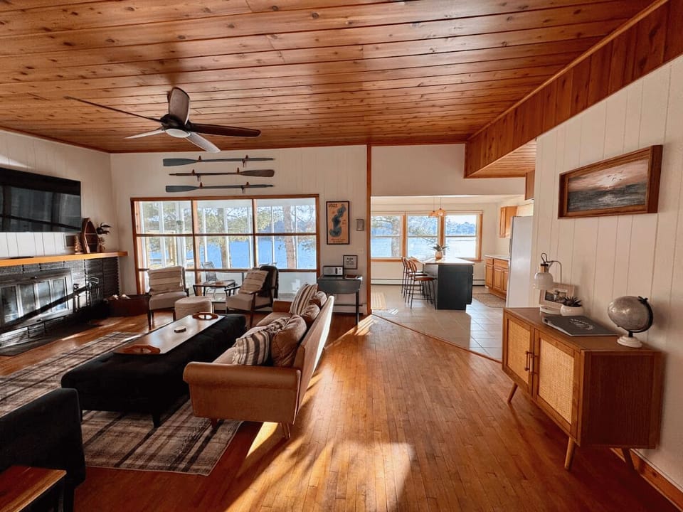 Panoramic windowed views feel like a treehouse overlooking the water.