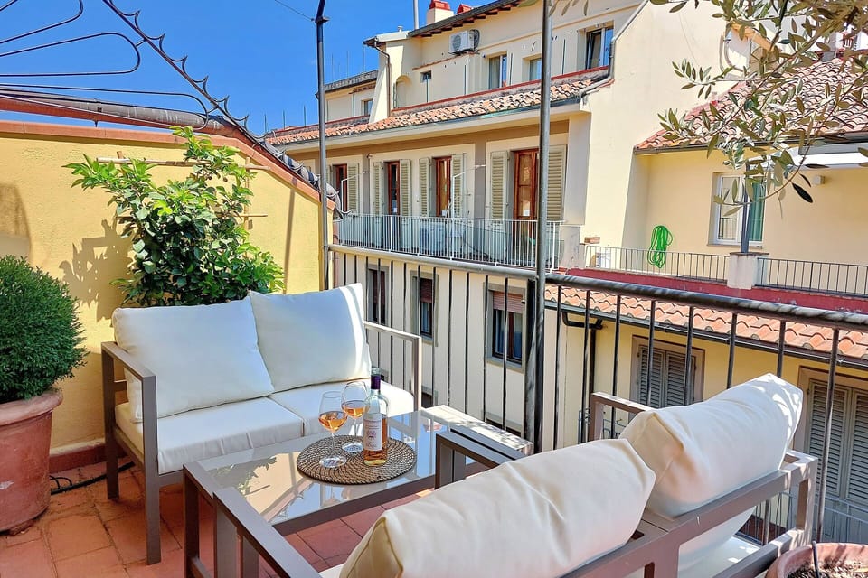 Lounge area on the terrace with Florence rooftop views.
