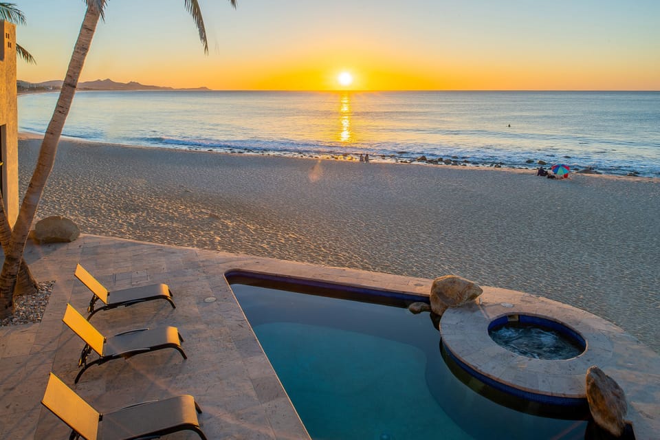 Lounge by the poolside with ocean views