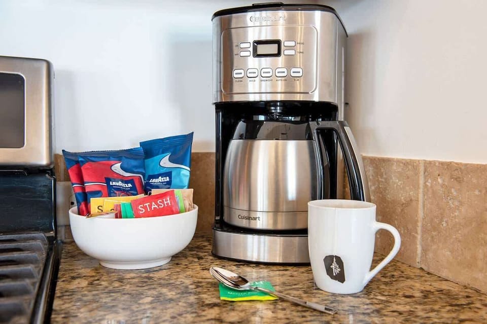 Premium coffee, tea, sugar, stevia, and creamer are provided.