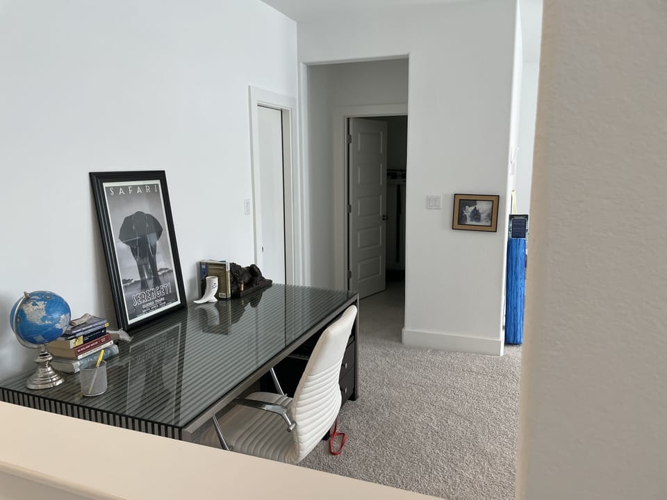 Upstairs game room/gym with half bath.