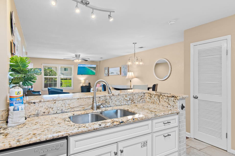Beautiful granite countertops and an open kitchen layout that keeps you connected to all the fun happening in the living and dining areas
