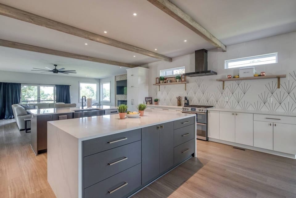 This fully equipped kitchen includes stainless steel appliances, an oven, stove, microwave, dishwasher, fridge, freezer, and a coffee maker with a starter supply of pods. You’ll also find cooking and baking basics, a toaster, blender, BBQ utensils, wine glasses, outdoor plates, a full dining set, and even Alexa for music—all complemented by high-speed WiFi to keep you connected.