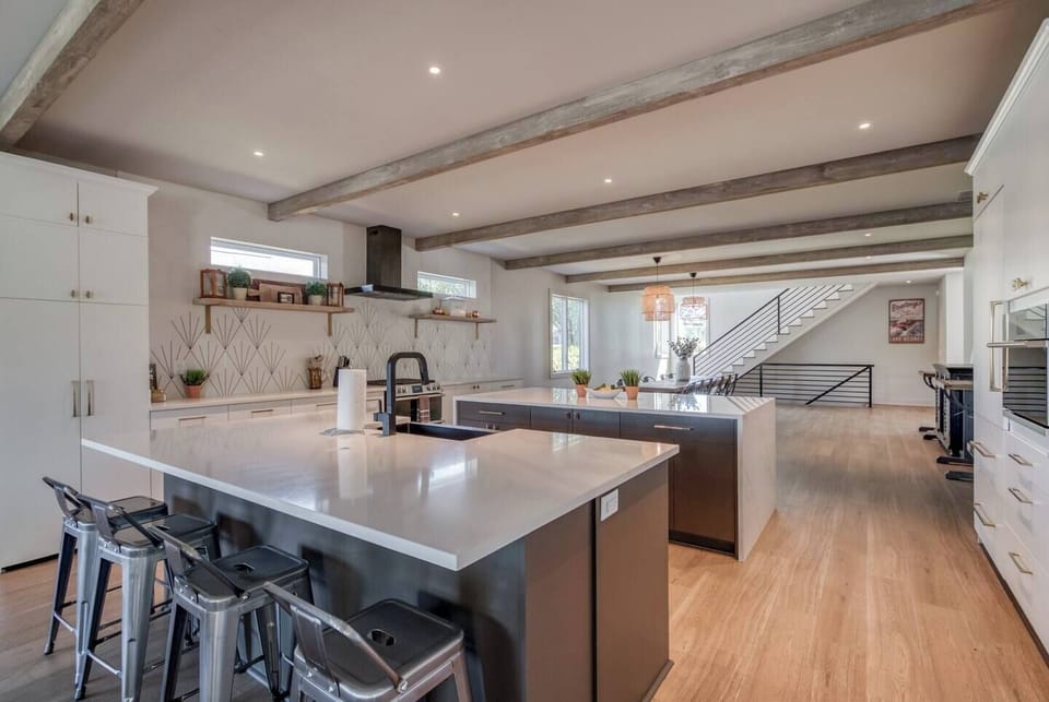 Stainless steel appliances, microwave, oven, stove, dishwasher, fridge/freezer, coffee maker, toaster, blender, wine glasses, dining set, BBQ utensils, outdoor plates, baking & cooking basics, Alexa music, WiFi, plus starter amenities.