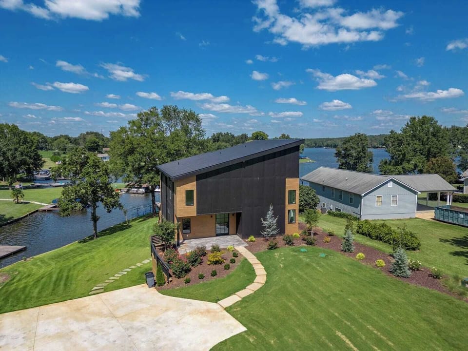 On-site parking and direct access to Lake Oconee with a private dock, all situated in a peaceful cove. Please note: there is no fence separating the property from the water’s edge.