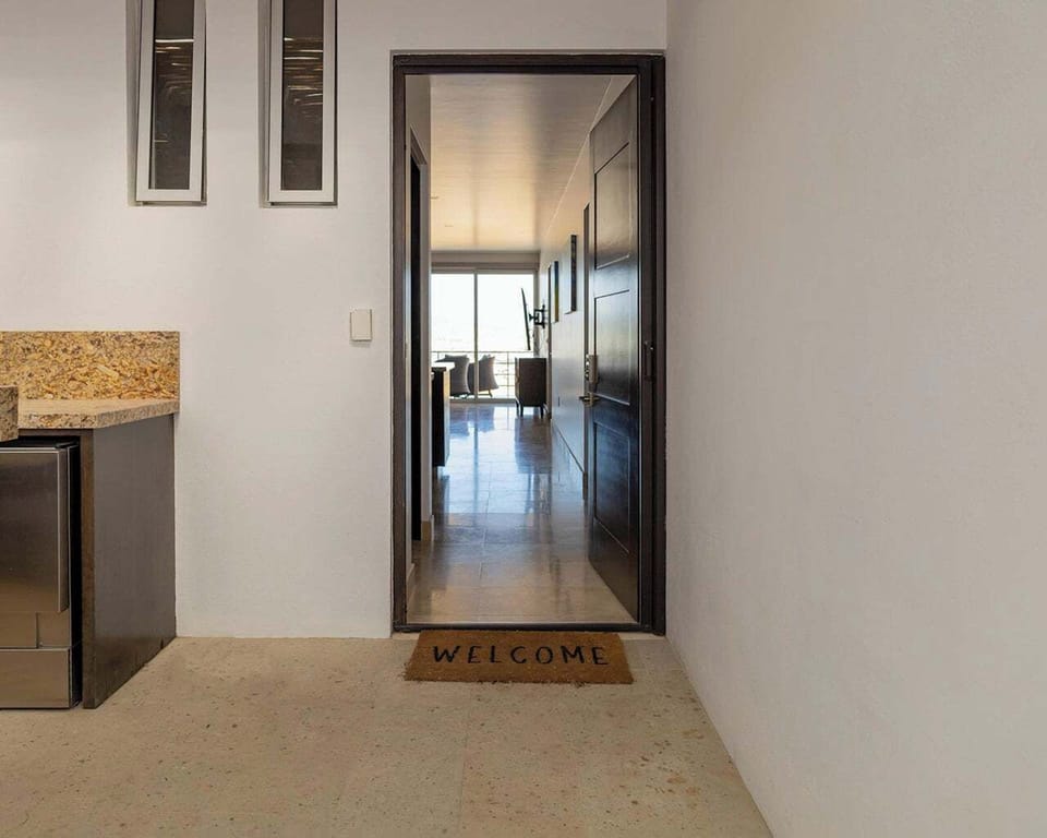 Indoor entry from private full patio/bar entertainment area to condo