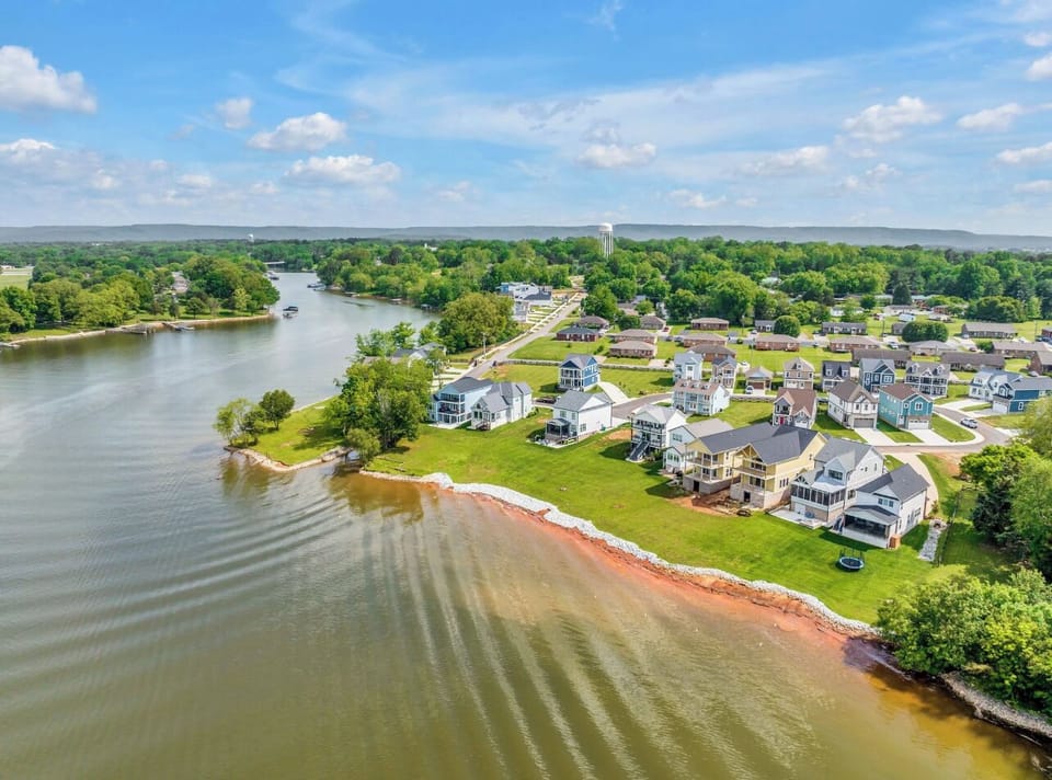 Birds eve view of your Lakehouse - Teal colored by the swimming pool/ trees left