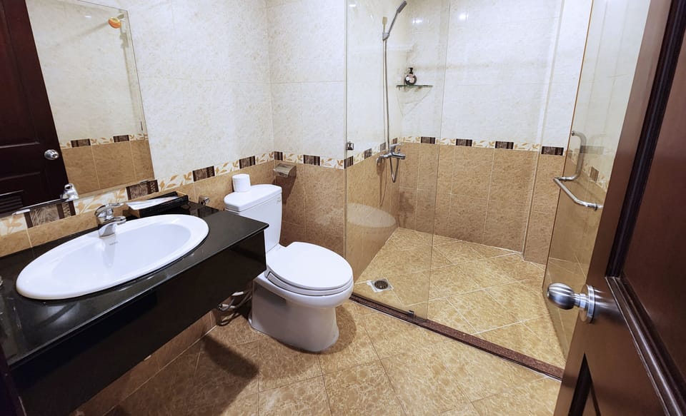 Shower, hydromassage showerhead, designer toiletries, hair dryer
