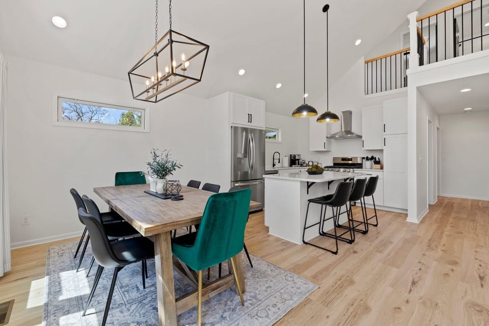 Experience the perfect blend of rustic charm and contemporary style with this farmhouse-modern dining table. With seating for 8 at the table and 3 more at the counter, it's the ideal space to gather and enjoy delicious meals with family and friends.