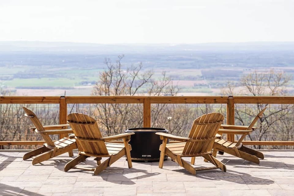 The fire pit and gorgeous background views overlooking the valley
