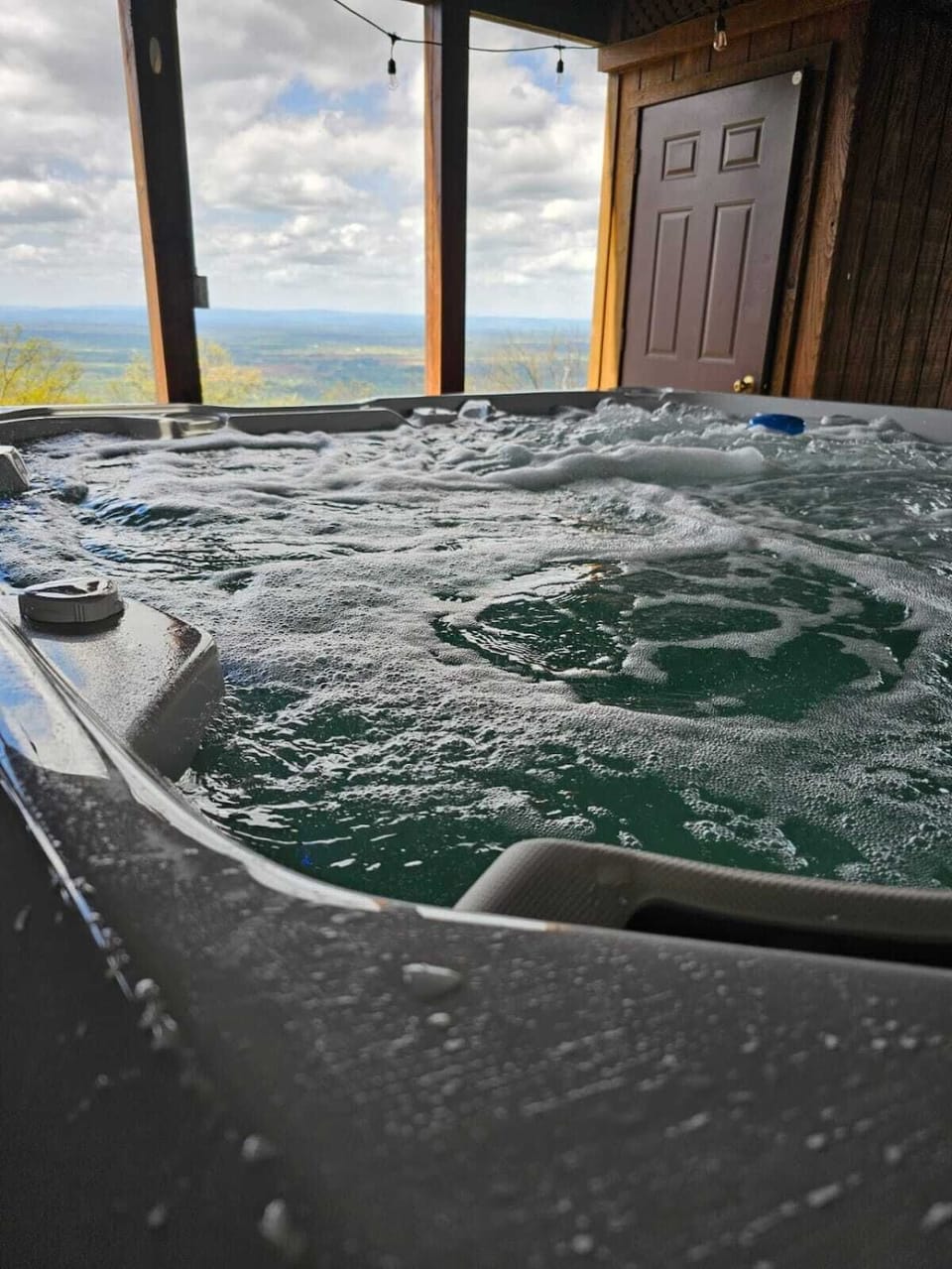 Hot tub with string lights for the perfect evening