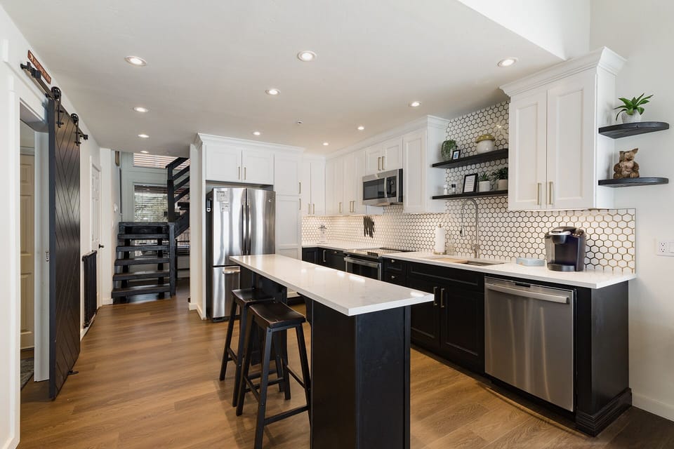 Fully Stocked Kitchen with Kitchen Island and Seating