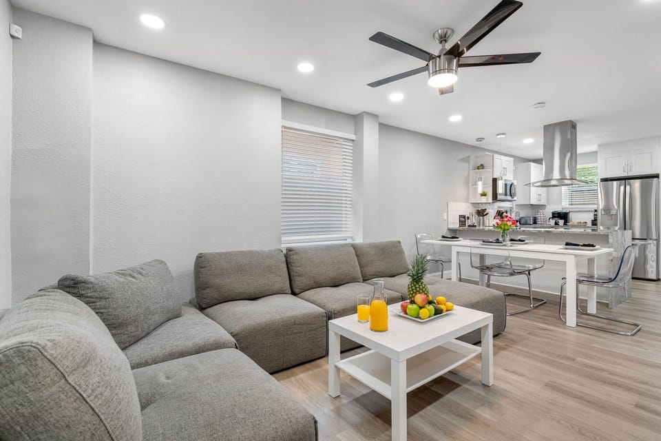 In addition to the couch, the living area features a mix of modern and classic decor elements.