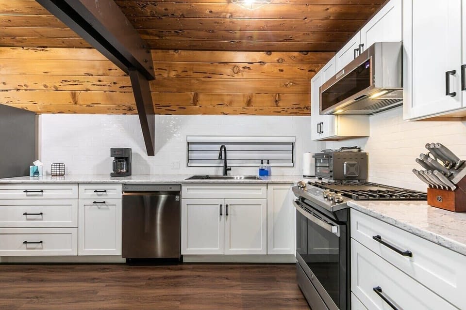 The kitchen features stainless steel appliances and spacious counter space making meal prep a breeze.