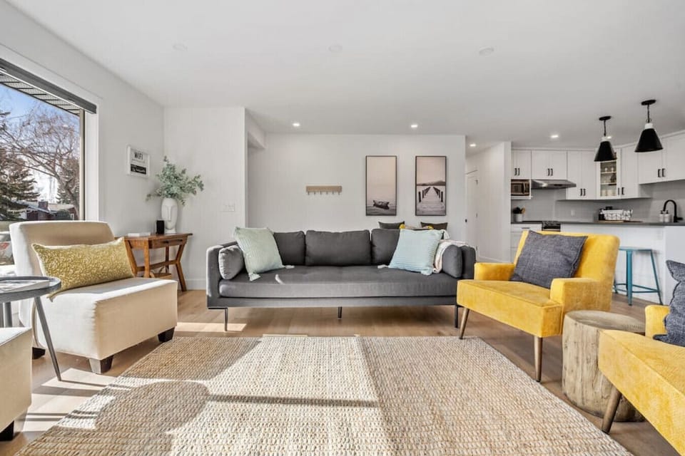 Main floor living area with a Smart TV, electric fireplace and cozy seating options.