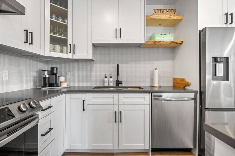 Full kitchen with a drip coffee machine, ground coffee, tea, sugar and basic condiments (ketchup, mustard and relish.)