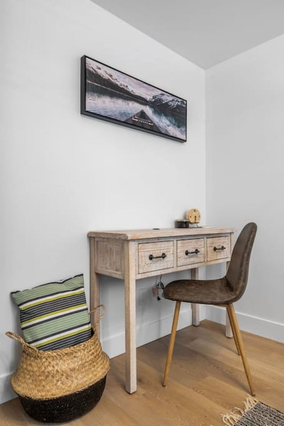 Primary bedroom with a double bed, closet, dedicated workstation and room-darkening shades.