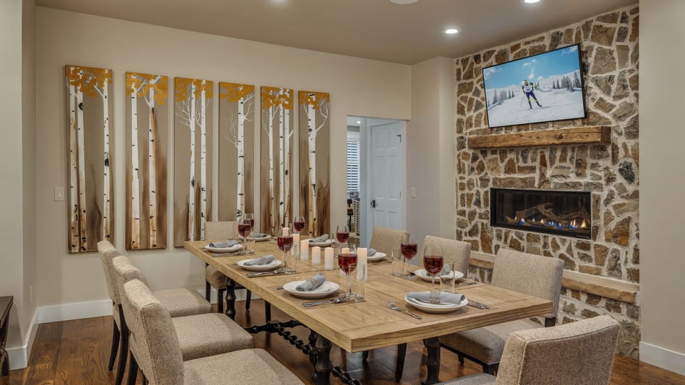 Dining area with fireplace and TV