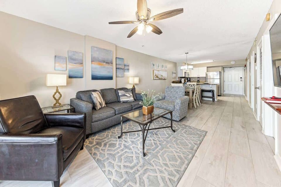 Open living area with plenty of seating and Gulf views beyond.