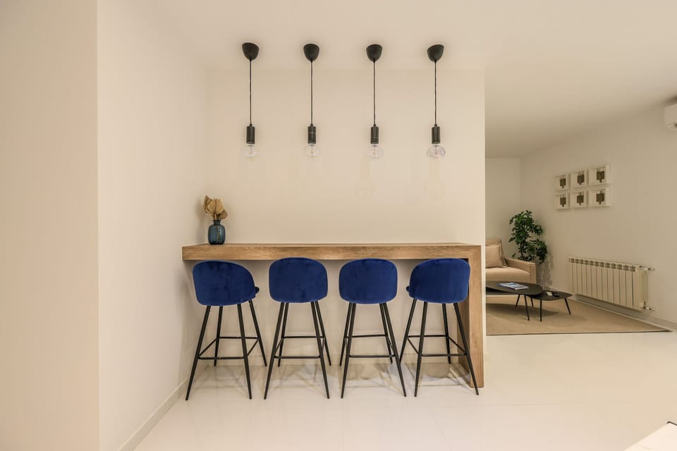 Dining area with high table and stools