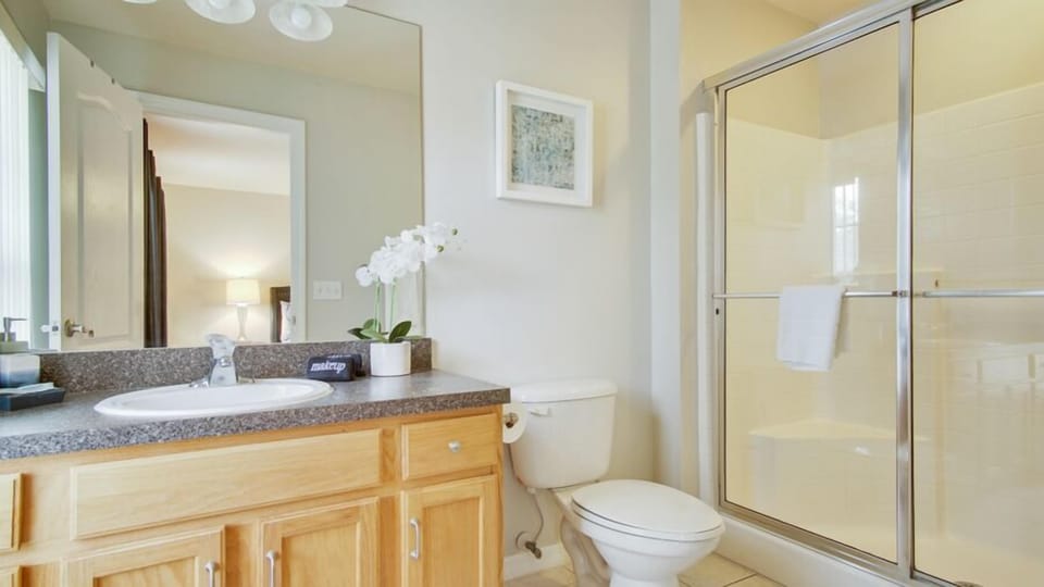 Bathroom 2 - En-suite off Bedroom 2 with walk in shower, sink, toilet, hair dryer1