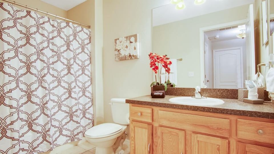 Bathroom 3 - Family bathroom with bath/shower combo, sink, toilet