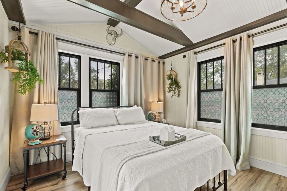 Primary suite with vaulted ceiling and loads of natural light