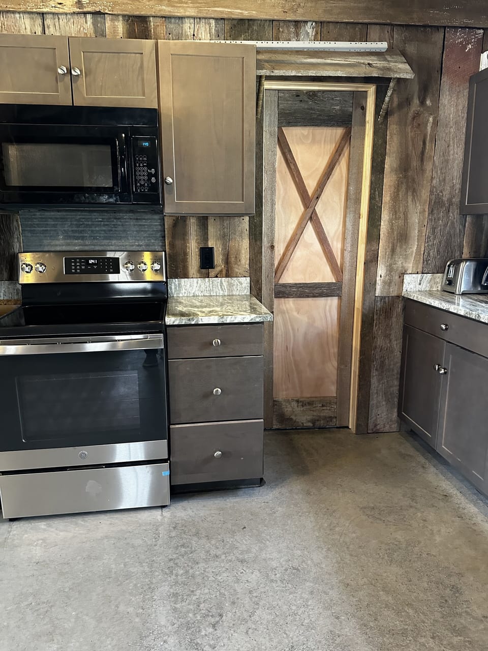 The little wood door leads to the bathroom.