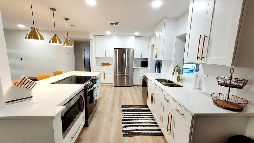This brand new kitchen is stocked with everything you need for your meals in!