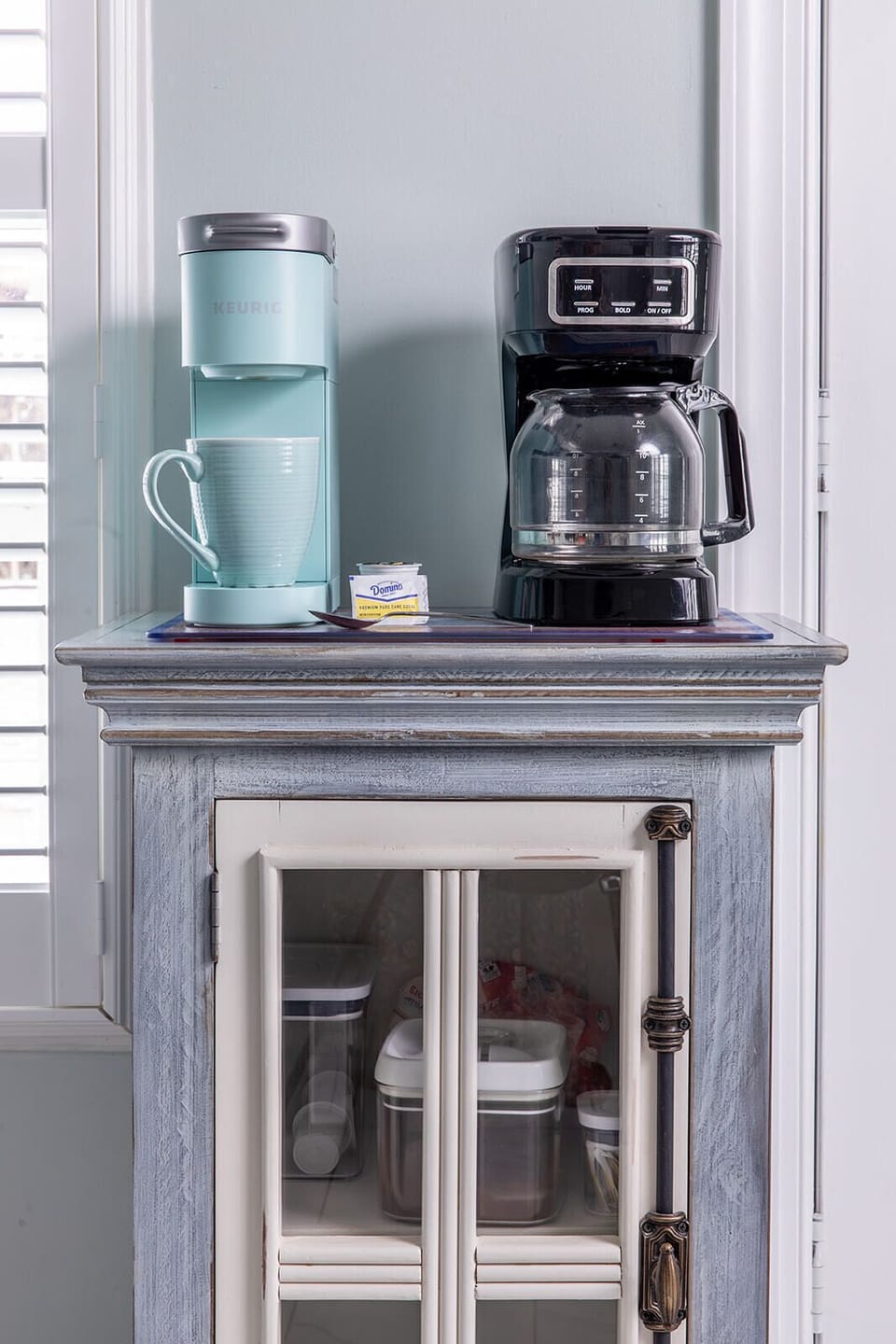 Start the day at the coffee bar, stocked with a brewer, Keurig, filters, grinder, ground coffee, pods, and sweeteners. Brew a cup, step outside, or settle in and ease into the morning.