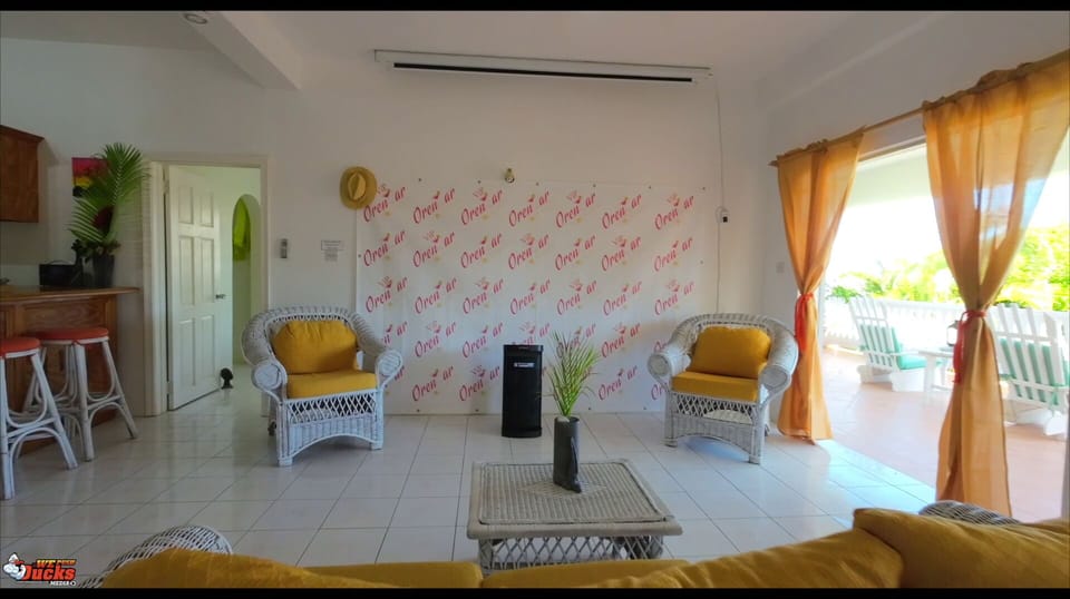 Living room with wall projector and view of balcony 