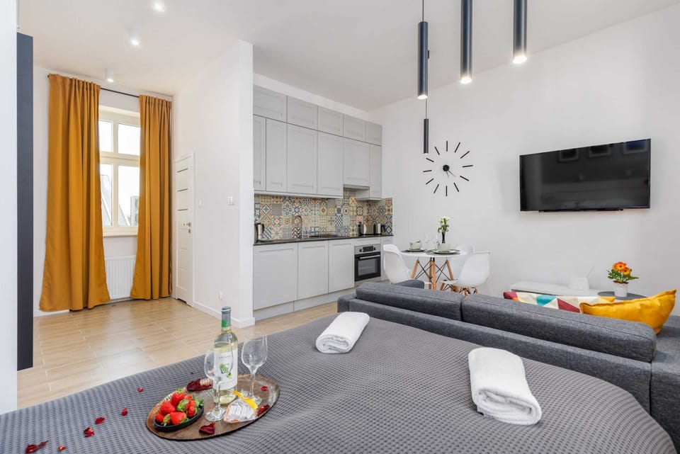 A cozy living space with a coffee table set with refreshments for guests to enjoy.
