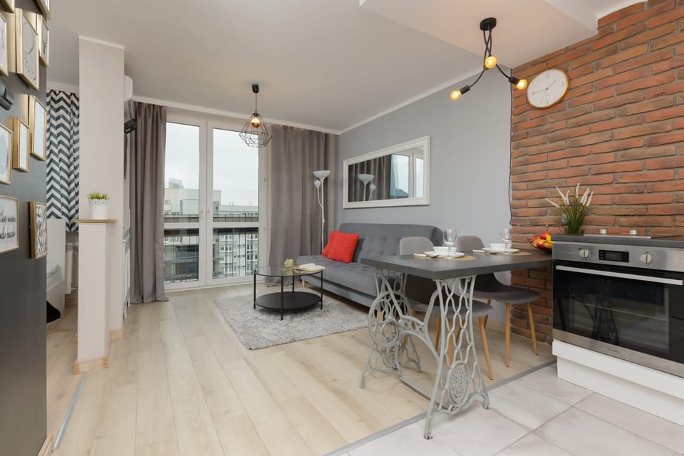 A well-designed living room in neutral tones, enhanced by modern furniture. The space feels warm and inviting, ideal for relaxation.