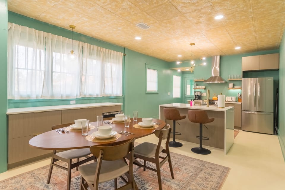 Normal size kitchen island with oversized overhang and 2 bar stools