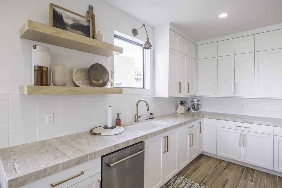 Kitchen Countertop - The Kitchen is complete with everything you will need for meal preparations including pots, pans, baking dishes, plates, cups, silverware, cutlery, and an assortment of cooking utensils.