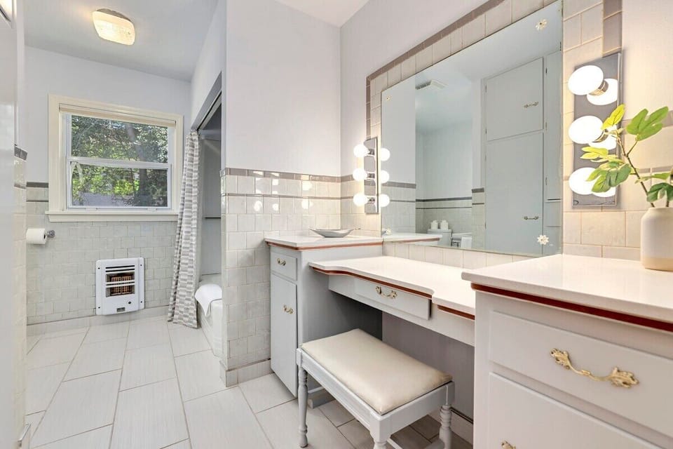 Here, you'll also find a vanity with tons of counter space.
