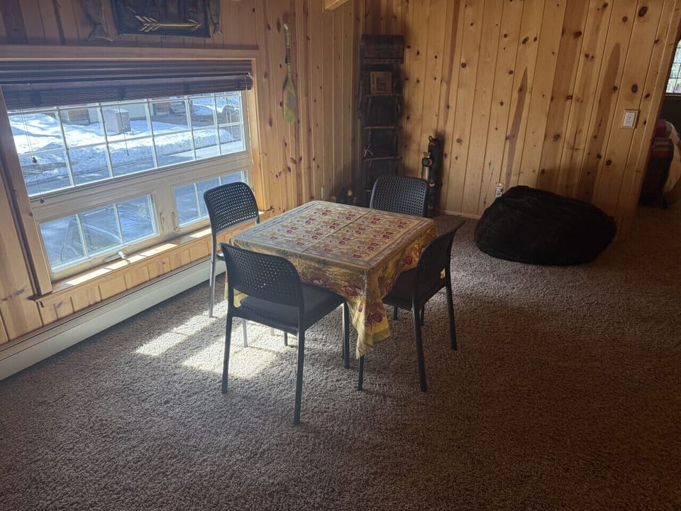 Small sitting table great for cards or puzzles in the bonus living room area.